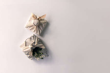 Several pastel-colored furoshiki gifts and craft decor Beautiful gift wrapping and handicraftの写真素材