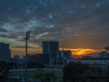 The Sun is moving down in the center of Bangkokの写真素材