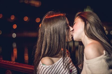 Kiev, Ukraine 06 june 2016 Two young girls kiss on the bridgeのeditorial素材