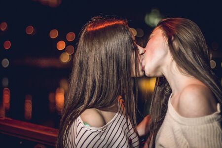 Kiev, Ukraine 06 june 2016 Two young girls kiss on the bridgeのeditorial素材