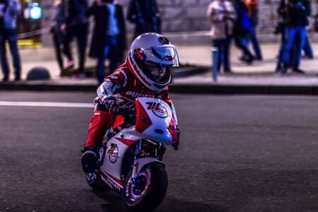 Ukraine, Kiev August 2017 the little boy on the racing motorcycleのeditorial素材