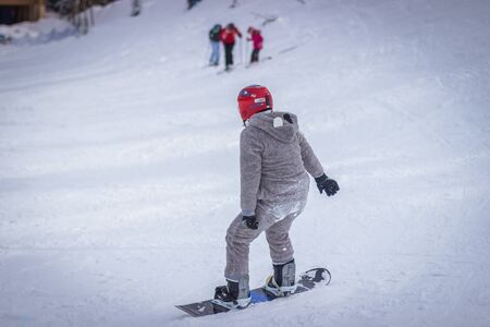 Dragobrat, Ukraine - December 26, 2018: Girls and boys ski ingly ski and snowboardのeditorial素材