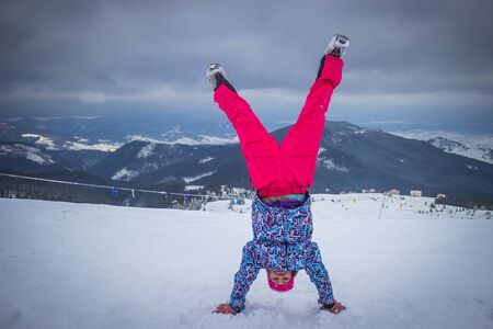 Dragobrat, Ukraine - December 26, 2018: Girls and boys ski ingly ski and snowboard
