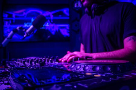 Dj mixes the track in nightclub at partyの写真素材
