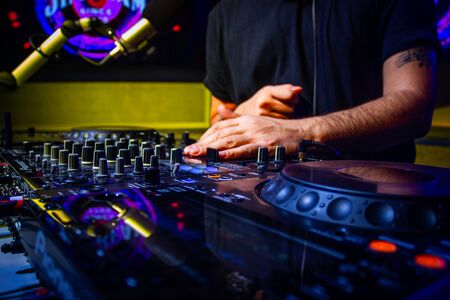 Dj mixes the track in nightclub at partyの写真素材