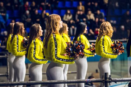Kiev, Ukraine - December 17, 2019: ice hockey u20 world championship Ukraine - Ukraine VS Italy Group of cheerleaders in action with male coachのeditorial素材