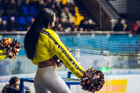 Kiev, Ukraine - December 17, 2019: ice hockey u20 world championship Ukraine - Ukraine VS Italy Group of cheerleaders in action with male coachのeditorial素材