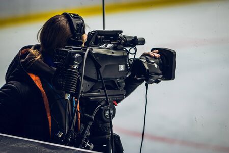 Cameraman at work. Shallow dof effect. ice hockey u20 world championship Ukraineの写真素材