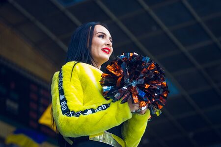 Kiev, Ukraine - December 17, 2019: ice hockey u20 world championship Ukraine - Ukraine VS Italy Group of cheerleaders in action with male coachのeditorial素材