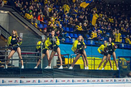 Kiev, Ukraine - December 17, 2019: ice hockey match Group of cheerleadersのeditorial素材