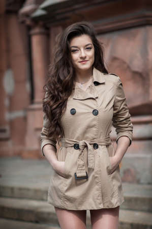 Outdoor lifestyle portrait of pretty young girl in casual style.の写真素材