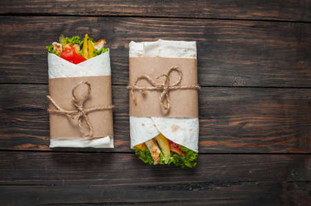 Burrito with grilled chicken and vegetables - pita bread, shawarma.の写真素材