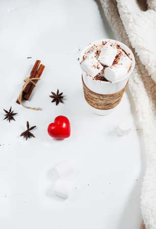 Hot cocoa with marshmallows on white table.の写真素材