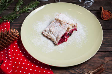 Christmas cherry strudel with marshmallow on wood table.の写真素材