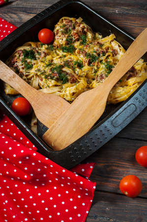 Baked rolled pasta with forcemeat and cheesy tomato sauceの写真素材