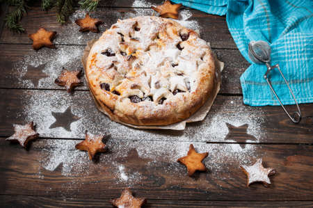 Cherry pie and cookie on rustic wooden background.の写真素材