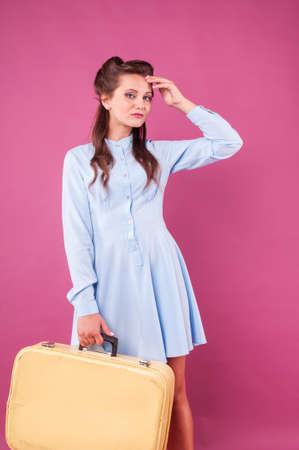Portrait happy young woman with suitcase. Travel.の写真素材