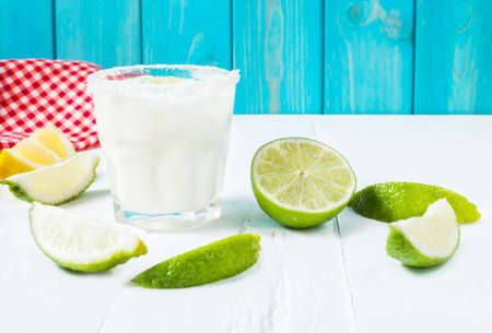 Margarita cocktail on a white wooden table.の写真素材