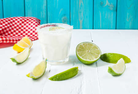 Margarita cocktail on a white wooden table.の写真素材