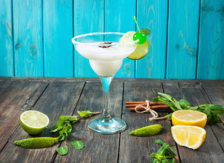 Margarita cocktail on a brown wooden table.の写真素材