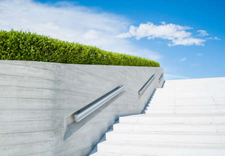 Modern white stairs leading to a square. Urban architecture.の写真素材