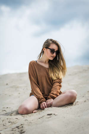 Stylish woman at the summer beach in a hot day.の写真素材