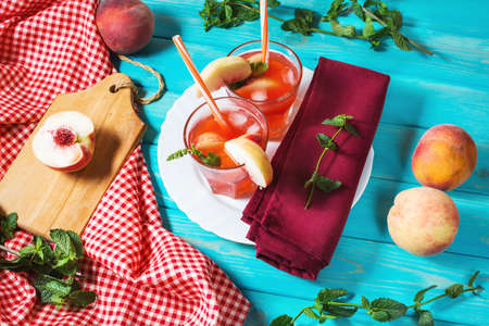 Homemade lemonade with ripe peaches and fresh mintの写真素材