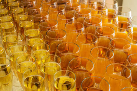 catering services. glasses with wine in row background at restaurant party.の写真素材
