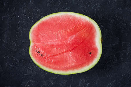 cut watermelon on a darkgrey background. Top viewの写真素材