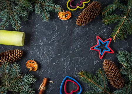 Christmas background with fir tree and cones, candle. Top view with copy space.の写真素材