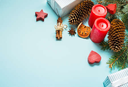Christmas background with decorations and gift boxes on blue board with copy spaceの写真素材