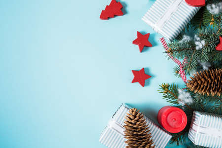 Christmas background with decorations and gift boxes on blue board with copy space. Top viewの写真素材