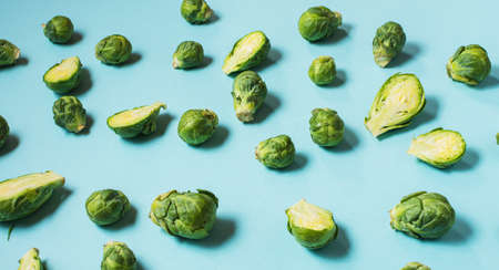 Raw fresh brussels sprouts on blue backgroundの写真素材