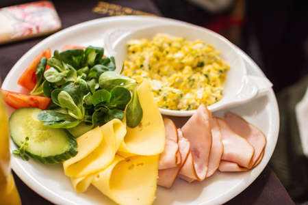 Breakfast with egg, ham, cheese and cucumbers. selective focusの写真素材
