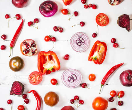 Flat lay fresh vegetables, fruits and berries on white wood backgroundの写真素材