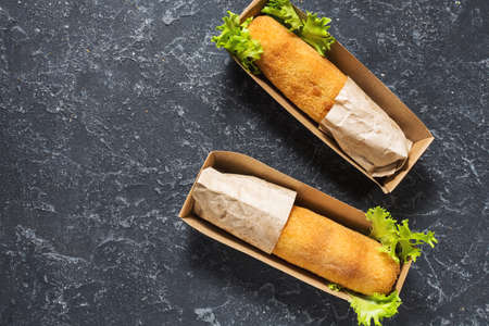Chicken Kiev cutlets in takeaway Box on stone background. Ukrainian tradition food.の写真素材