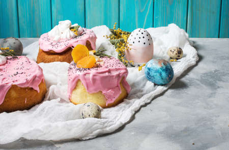 Easter composition with orthodox sweet bread, kulich and eggs on concrete background.の写真素材