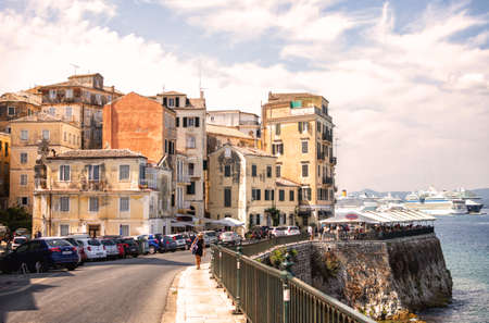 Corfu Island, Greece - 10.09.2019: Landscape view of the town of Kerkira. Stone pier and buildingsのeditorial素材