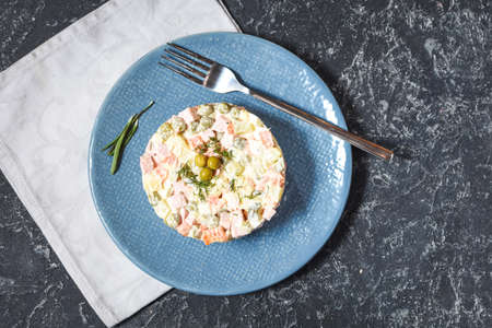 Russian traditional salad Olivier with vegetables and meat. Winter Christmas salad. Top viewの写真素材