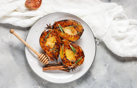 Caramelized pears with spices in syrup on a saucepan. Tasty dessert for holiday. Ingredients for ricotta cheese pie.の写真素材