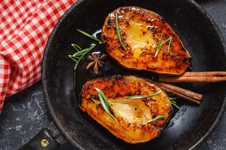 Caramelized pears with spices in syrup on a saucepan. Tasty dessert for holiday. Ingredients for ricotta cheese pie.の写真素材