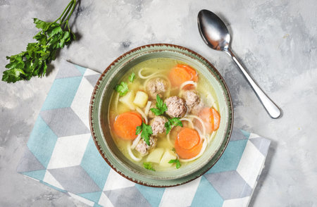 Meatball soup and ingredients on concrete table. Top view.の写真素材