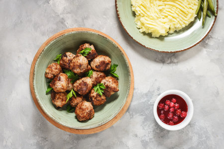 Swedish meatballs with mashed potatoes and green beans.