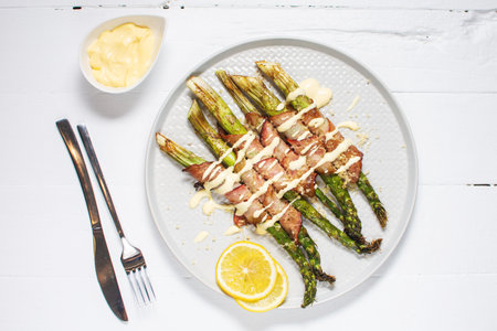 Grilled green asparagus wrapped with bacon. The ketogenic diet. Healthy food, diet menu. top view, overheadの写真素材