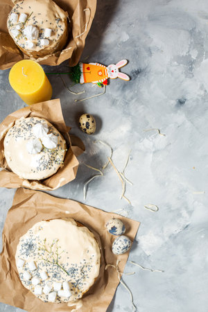 Easter egg and cake on gray concrete table. Happy easter backdrop for spring holiday. Card with a...