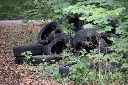 Tires thrown into the environment. Pollution of