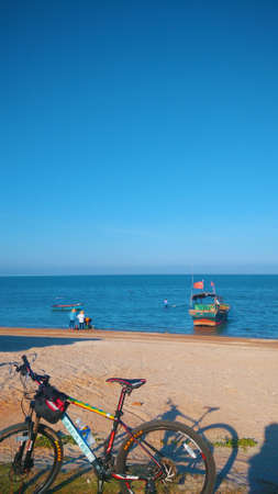 A bicycle on the beach in a clear skyのeditorial素材