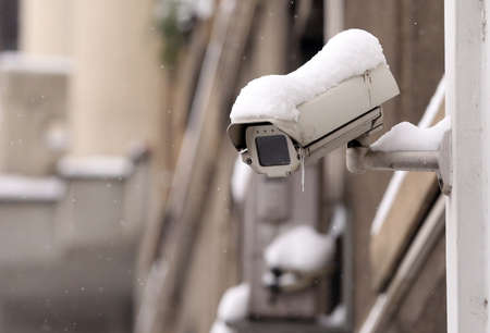 Surveillance camera covered with snow