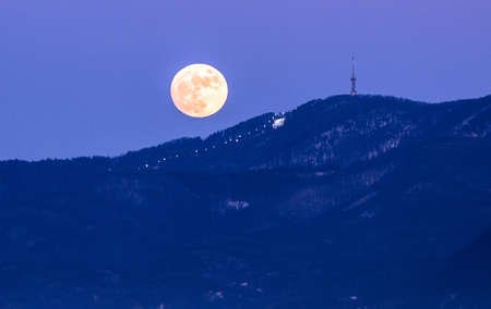 Moon over mountain Sljeme and ski courseの写真素材