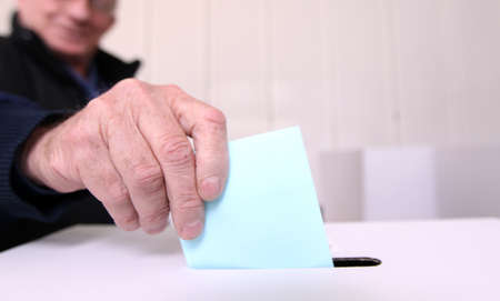 Older man voting at elections